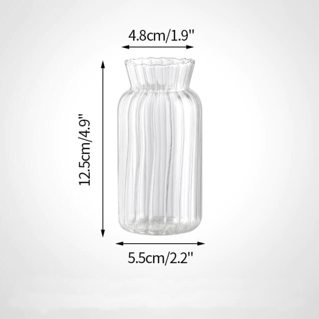 Clear glass vase with measurements.