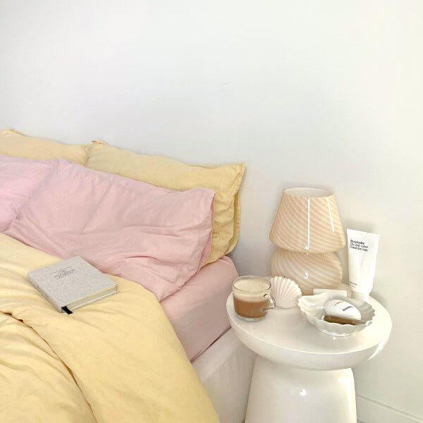 West Elm bedroom decor with pink and yellow bedding