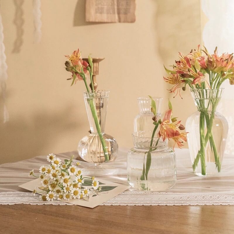 Glass vases with flowers on a table