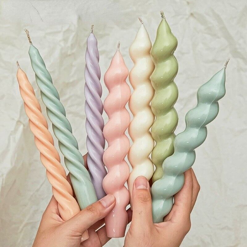 Twisted silicone candle mold with spiral candles