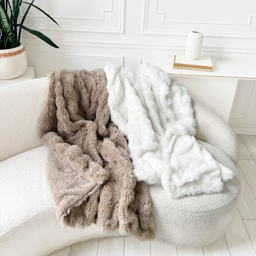 Faux fur throw blankets on sofa, thumbnail